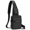 Sac bandoulière 18 x 8 x 31 cm en cuir synthétique noir à compartiments zippés